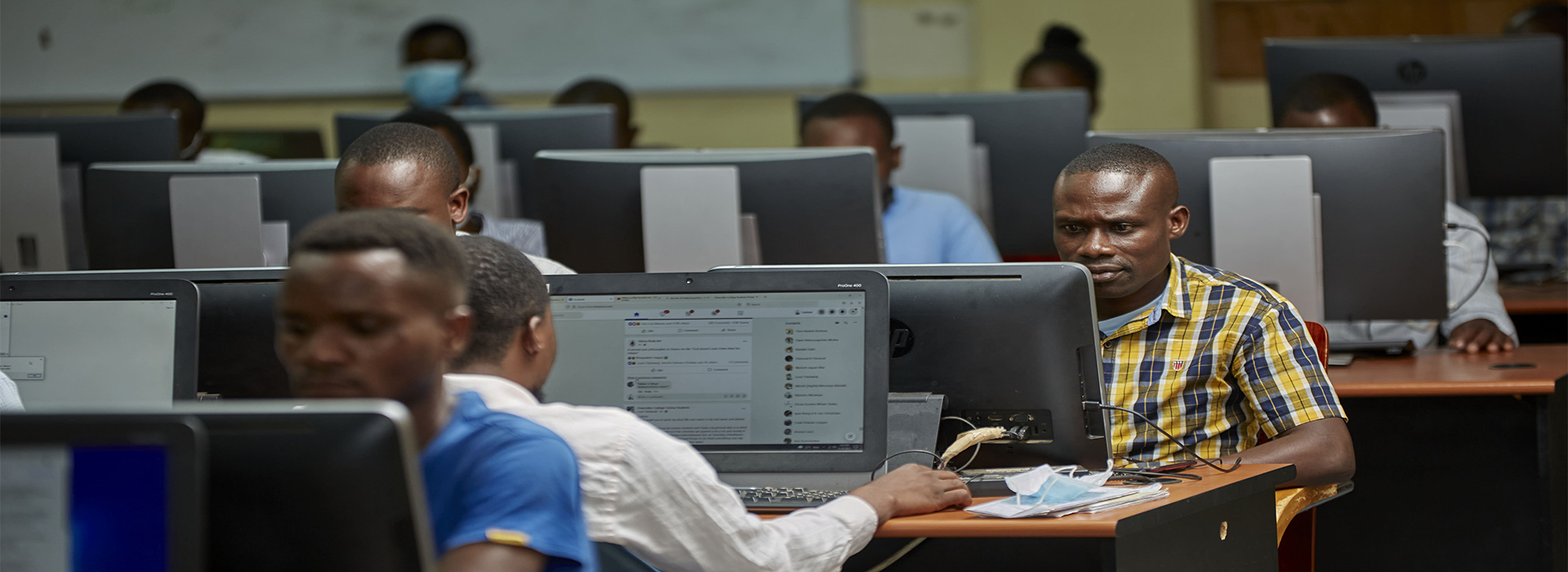 Researchers collaborating on computer terminals